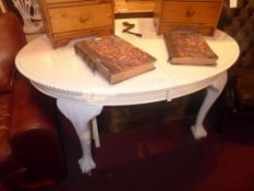 A white painted Queen Anne style mahogany dining table on cabriole suppports with two extra leaves