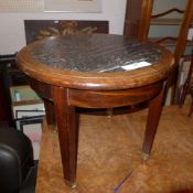 A C19th walnut low table with circular inset grey marble top and raised on square tapering supports