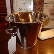 A silver plated twin handled wine cooler of oval form
