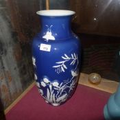 A Chinese blue glazed vase of large size decorated with flowers birds and insects in relief