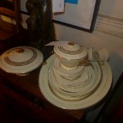 An Art Deco Empire Sovereign pattern part dinner set having gilding on an ivory ground