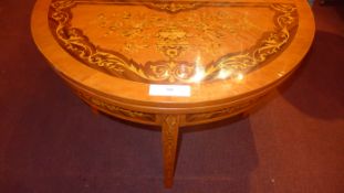 A Continental inlaid demi lune foldover tea table raised on square tapering supports