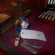 a penknife decorated with the ship 'frins bernhard' together with another three whistles, and a hand