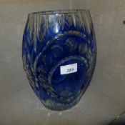 A cut blue glass vase with pictoral reserve of a fisherman