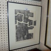 An Eduardo Chillida lithograph after a woodcut in a black frame