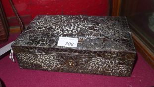 An Eastern white metal clad (most likely Indian silver) box with extensive floral detail in relief