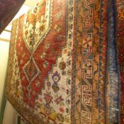 A fine North West Persian Heriz rug 200 cm x 140 cm stylised floral ivory medallions on a terracotta