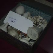 A collection of various porcelain crested tan ware
