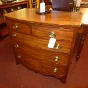 A C19th mahogany bow fronted chest fitted two short above three long drawers with brass oval plate