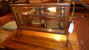 A Victorian mahogany swing frame dressing mirror with bevelled plate