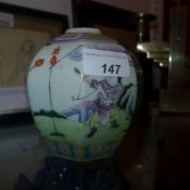 A Chinese octagonal form famille rose vase decorated with figures, having six character mark to