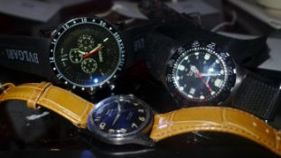 A Bvlgari style gents wristwatch together with two other similar watches (all working)
