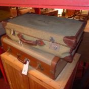 A collection of four vintage suitcases and one trunk