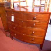 A C19th mahogany bow fronted chest fitted two short and three long drawers with knob handles