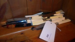 A quantity of silver plated knives