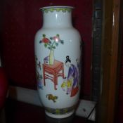 A pair of Chinese hand painted famille rose porcelain vases decorated with figural scenes