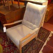 A pair of bleached walnut 1950's armchairs upholstered in grey linen fabric