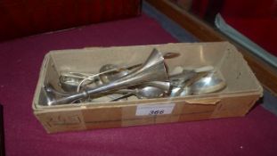 A collection of various silver spoons, sugar tongs, a silver posy vase and other items