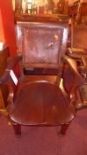 A C19th mahogany elbow chair with saddle seat and upholstered in leather (leather A/F)