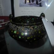 A Chinese with black and green mottled glaze on three feet