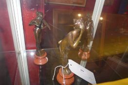 A set of three bronzes of female musicians on marble pedestal bases