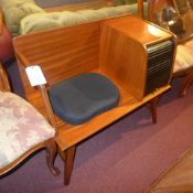A retro teak telephone seat with pad seat and tambour fronted cabinet beside