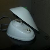 A 1950s Bauhaus white bakelite desk lamp with adjustable shade