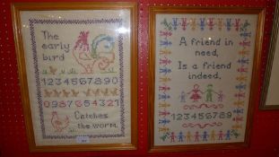 Two glazed and framed nursery samplers