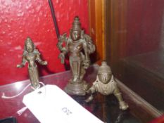 Two C19th Indian bronze figures of deities and a similar crouching C20th example