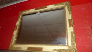A C19th French wall mirror the original rectangular plate within painted frame with gesso flowers in