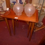 A Danish style teak nest of two tables