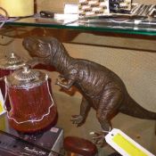 A bronze of a Tyrannosaurus Rex