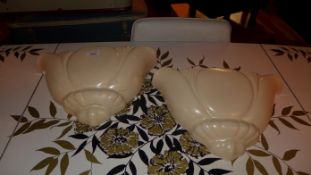 A pair of Dartmouth pottery cream glazed flower bud wall pockets (A/F)