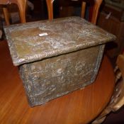 A embossed brass clad oak log bin depicting Continental domestic scenes