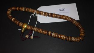 A string of Tibetan bone prayer beads