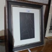 An Eric Gill print from a woodcut of a female nude in a silvered frame