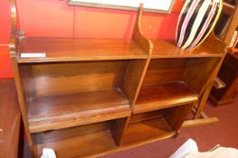 A mahogany open bookcase with adjustable shelves