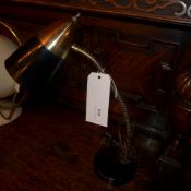 A 1950`s desk lamp with black painted shade on adjustable supports