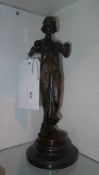A bronze model of a maiden raised on slate marble base