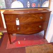 A Regency mahogany bow front chest fitted two drawers with brass handles on tapering supports