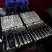 A cased set of silver teaspoons and two other part sets of silver teaspoons
