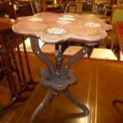 A C19th Indian carved hardwood and mother of pearl inlaid two tier occasional table on triform
