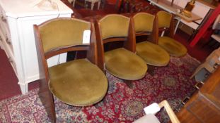 A set of four Art Deco oak dining chairs upholstered in green fabric