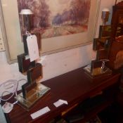 A pair of mirrored table lamps of stacked form