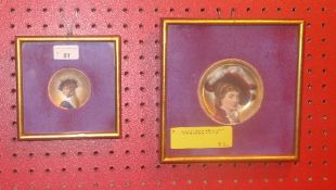 A pair of C19th porcelain dishes painted with portraits of ladies glazed in gilt frames