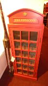 A painted wine rack in the form of a London phone box
