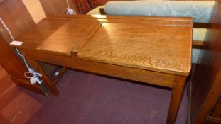 A mid C20th oak school desk