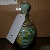 A 1950`s porcelain table lamp in the form of a meditating Buddha glased in white and hightened in