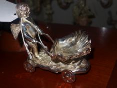 A silver plated salt in the form of a cherub and shell