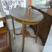 An Edwardian inlaid mahogany occasional